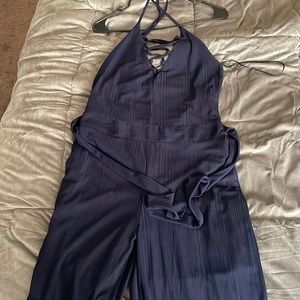 Elegant jumpsuit from boutique Seven by Lu. Color is Navy blue.